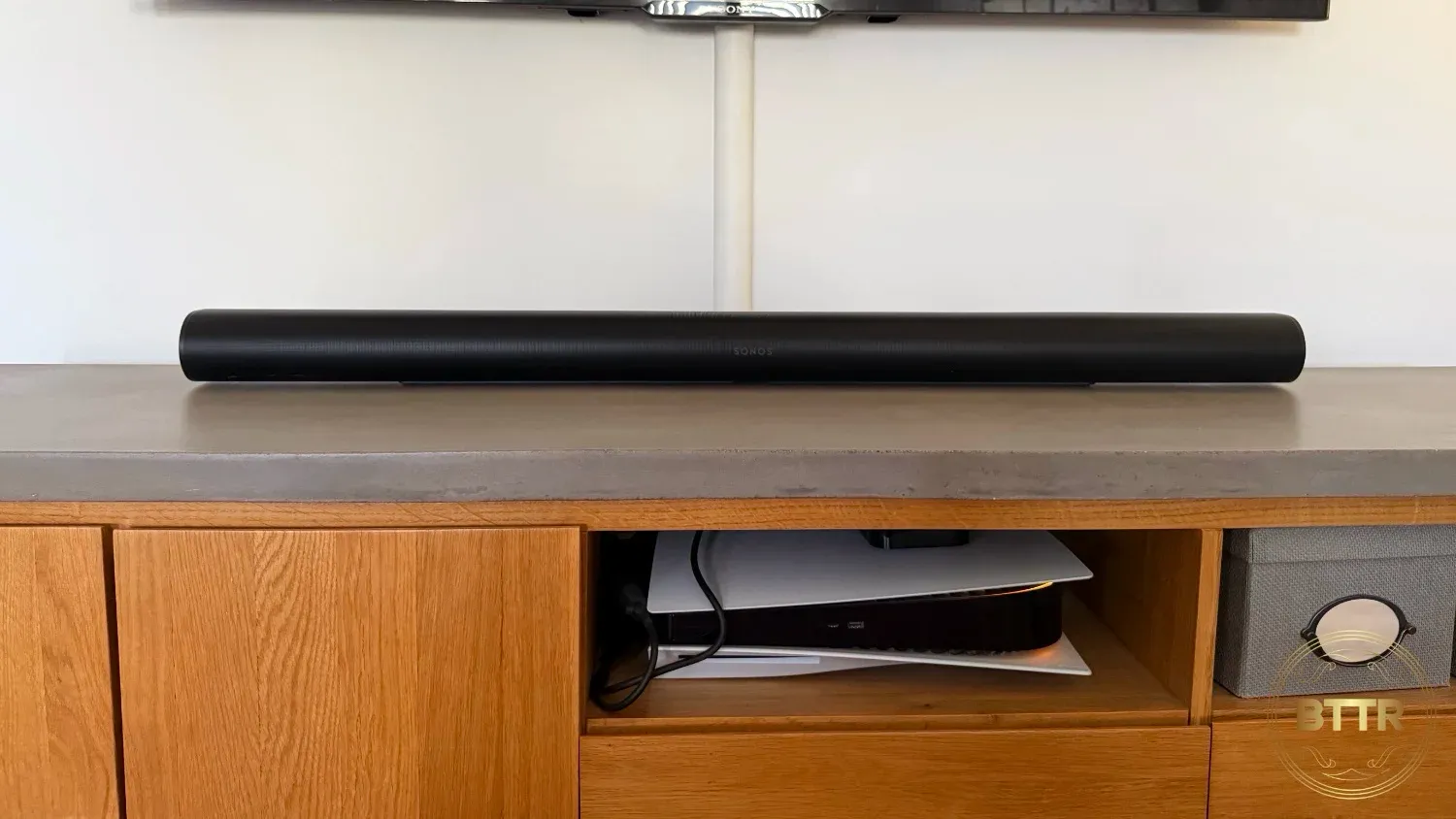 The Arc Ultra sits comfortably on an entertainment unit, or can be wall mounted.