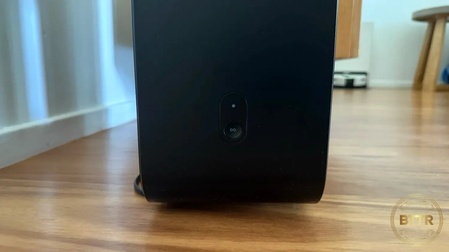 The pairing button on the back of the Sub 4
