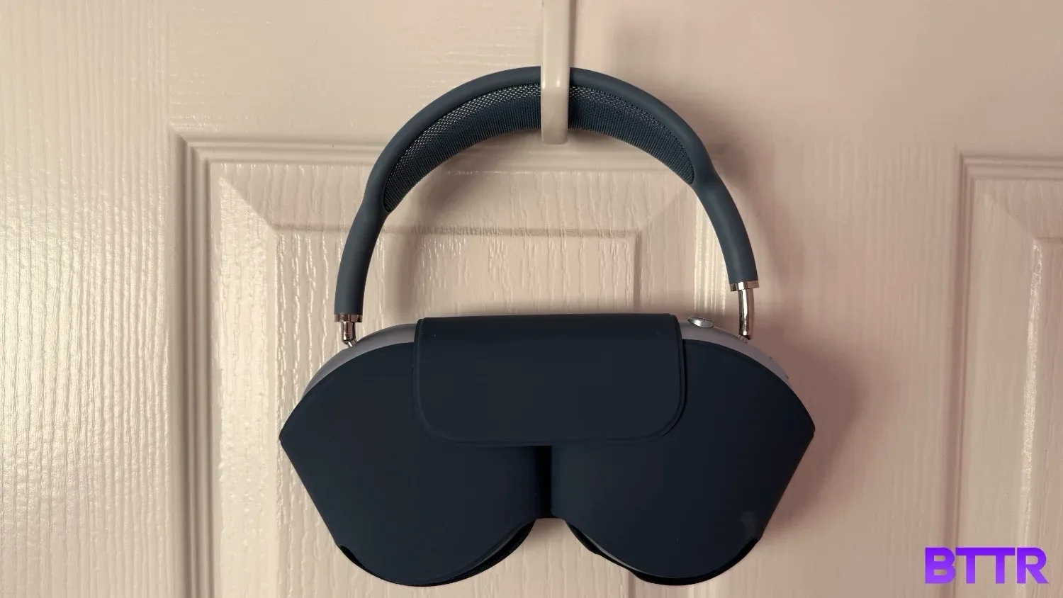 AirPods Max in the smart case hanging from ahook