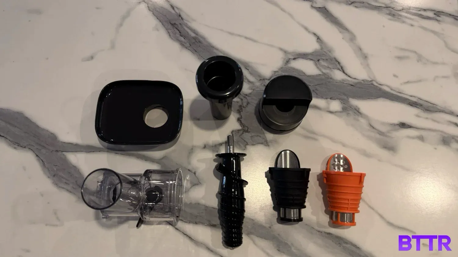 all the parts of the Neverclog laid out on a benchtop