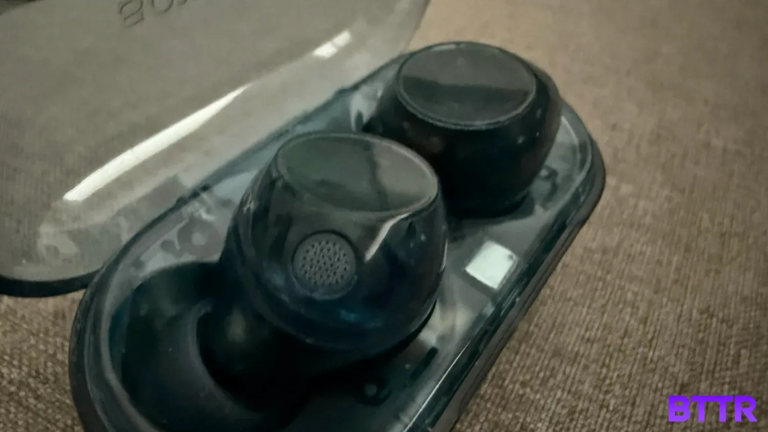 close up of the WF-C710N in their case