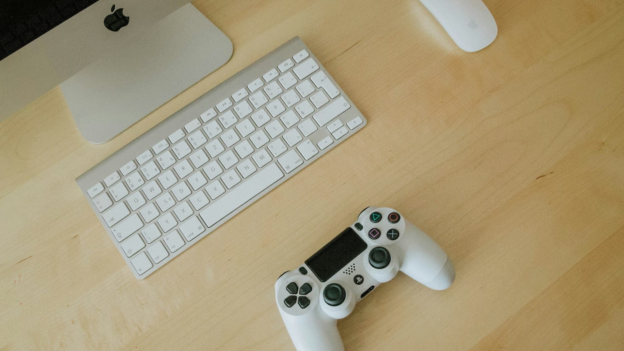white and black Sony PS4 controller