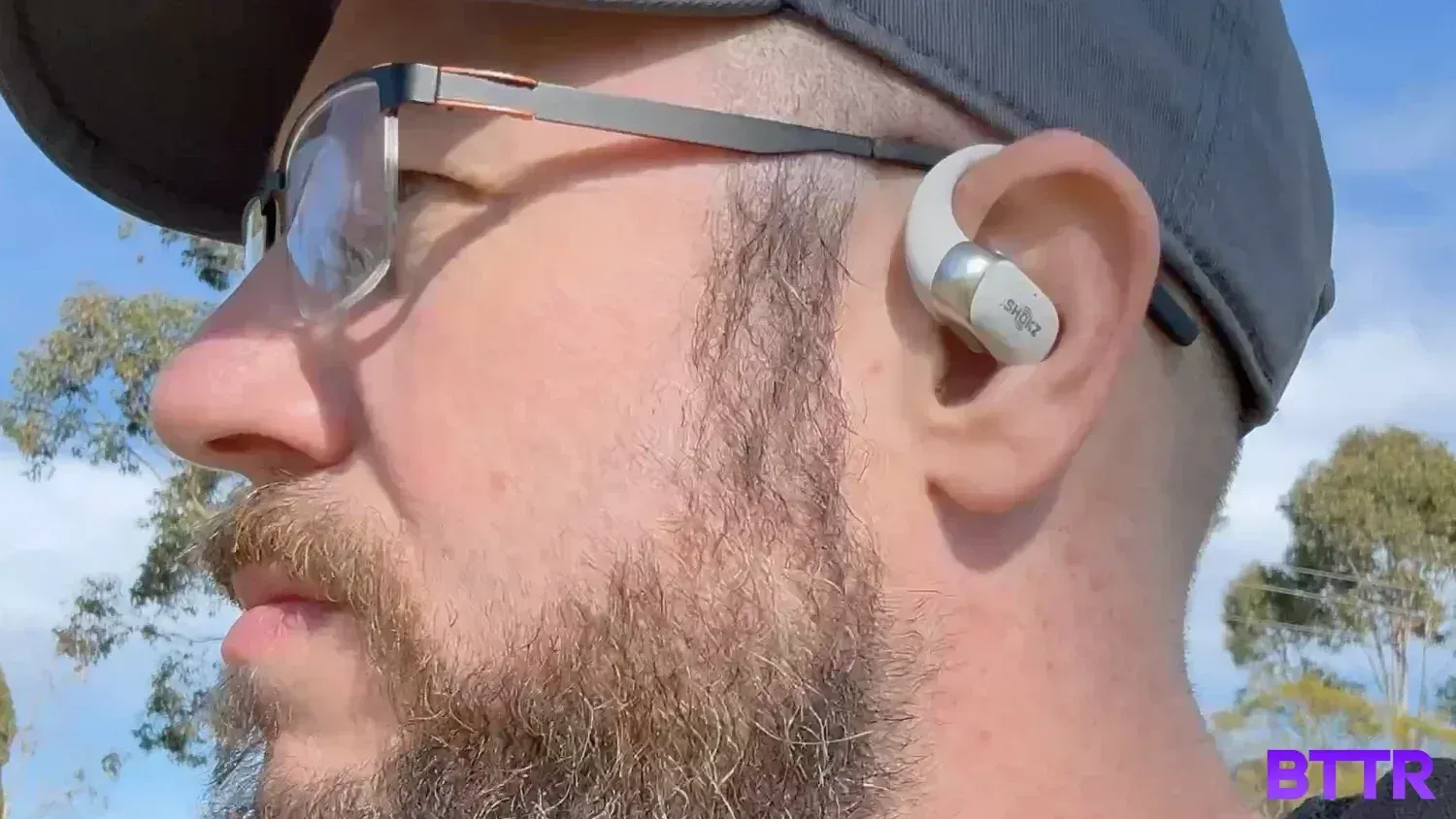 Shokz OpenFit2+ with glasses and a hat isn't the best way to wear these.