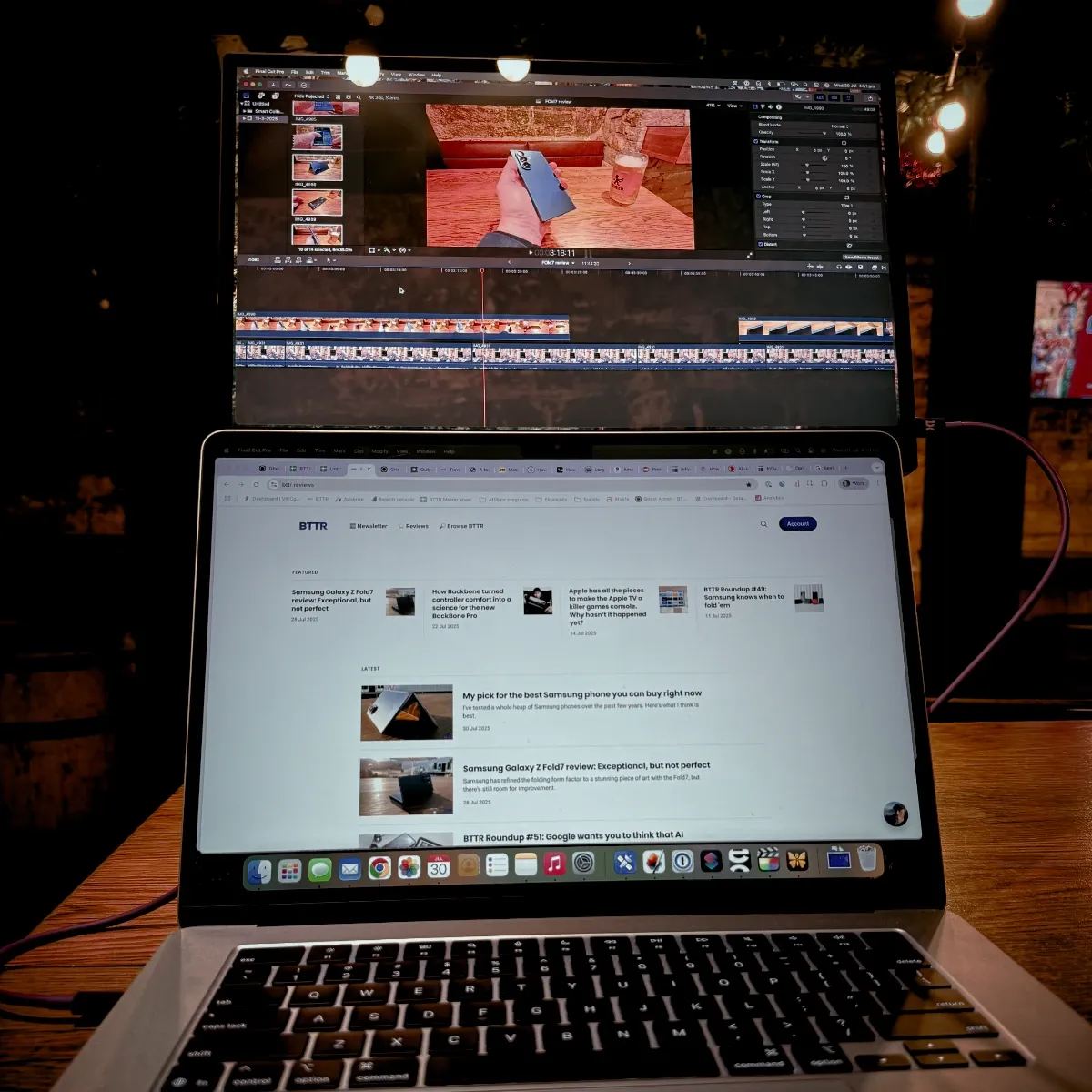 The 15 Pro above my laptop in a pub