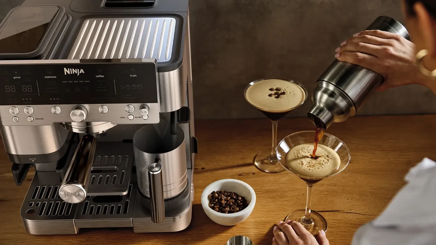 a person make espresso martinis with the ninja luxe café