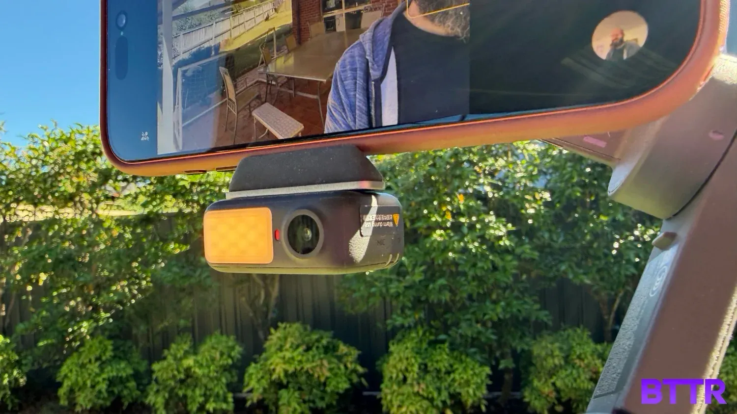 Close up of the Multifunctional Module attached to the grip of the DJI Osmo Mobile 8