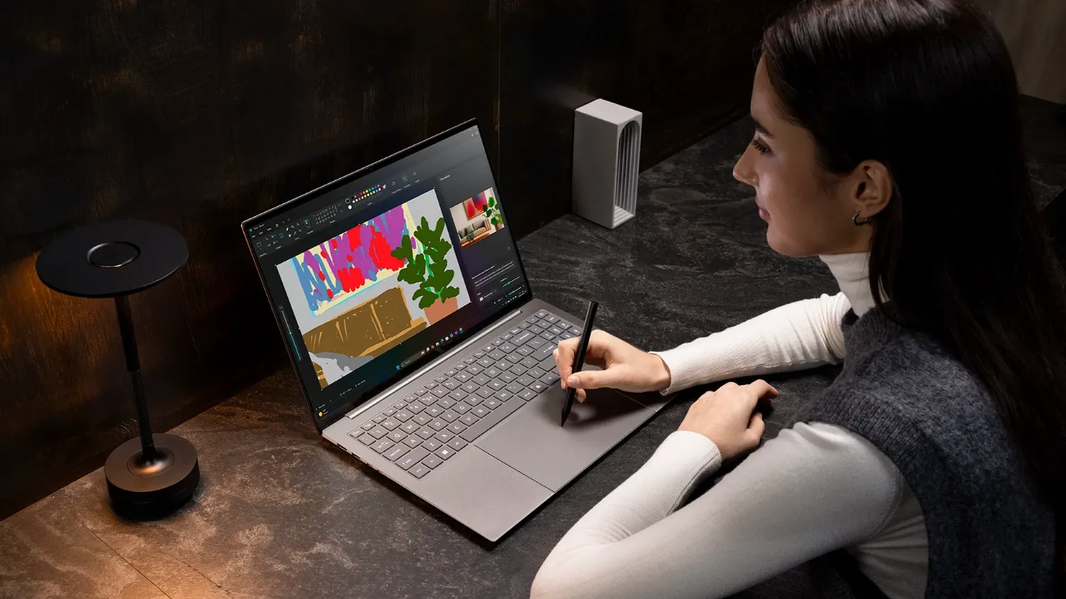 A woman using the Acer Swift trackpad with a stylus