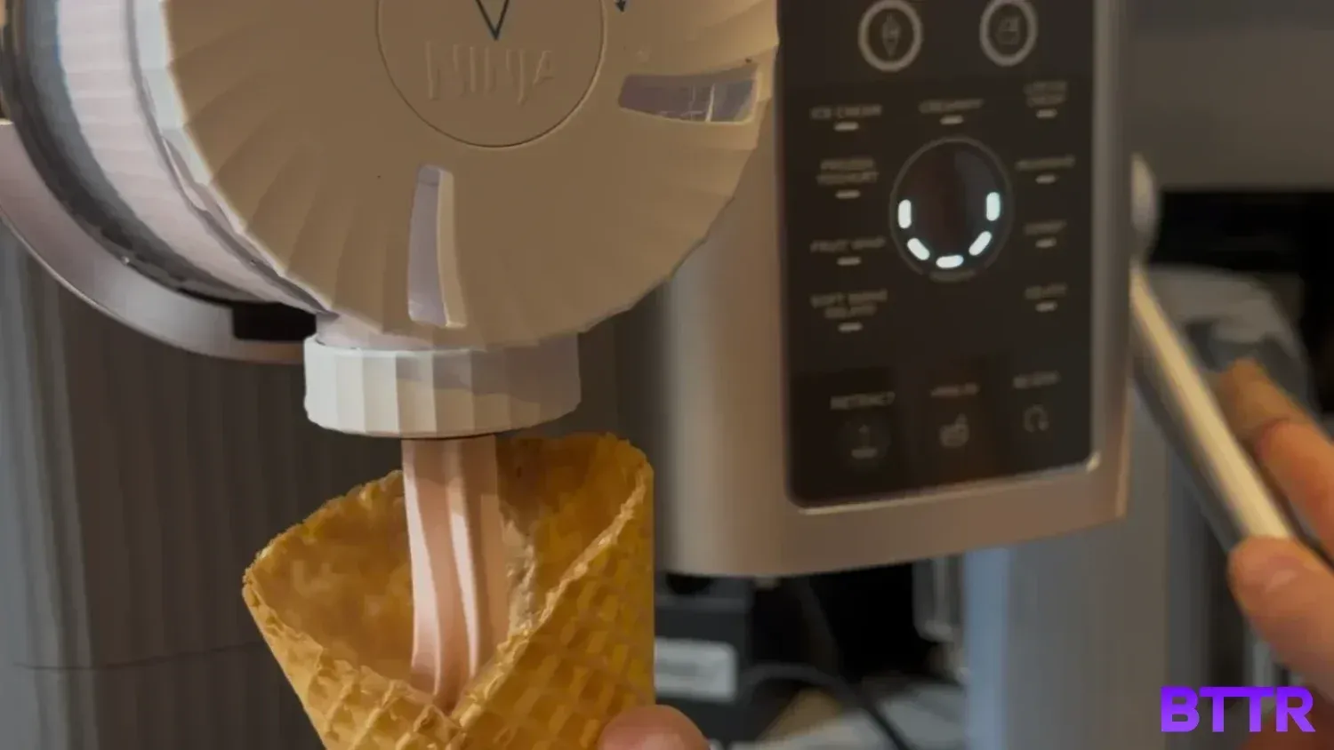 Pulling a soft serve ice cream from the Ninja Swirl by CREAMi