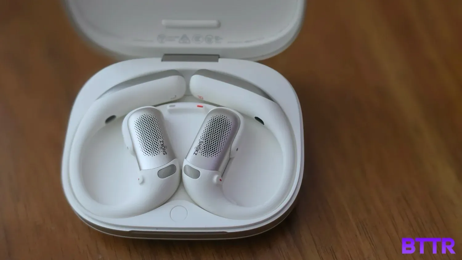 The Shokz OpenFit Pro charging in the case