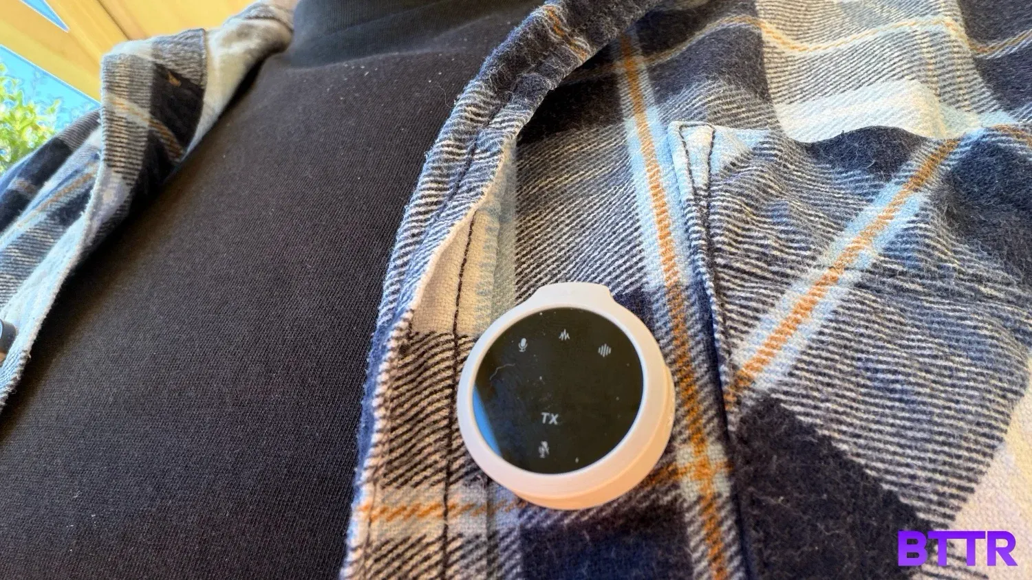 The Belkin Stage Creator Kit Mic attached to a shirt up close