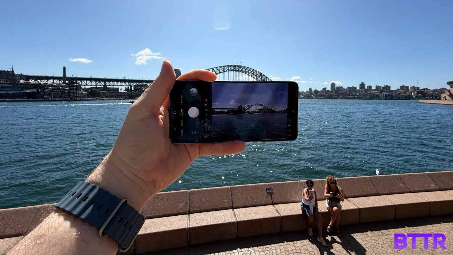 Holding the Samsung Galaxy S26 Ultra in front of the Harbour Bridge
