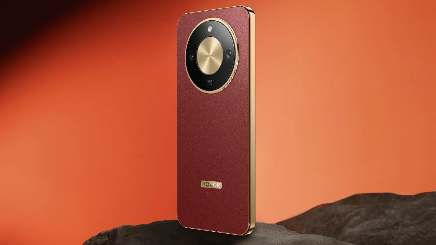The honor x9d 5g in reddish brown with an orange background