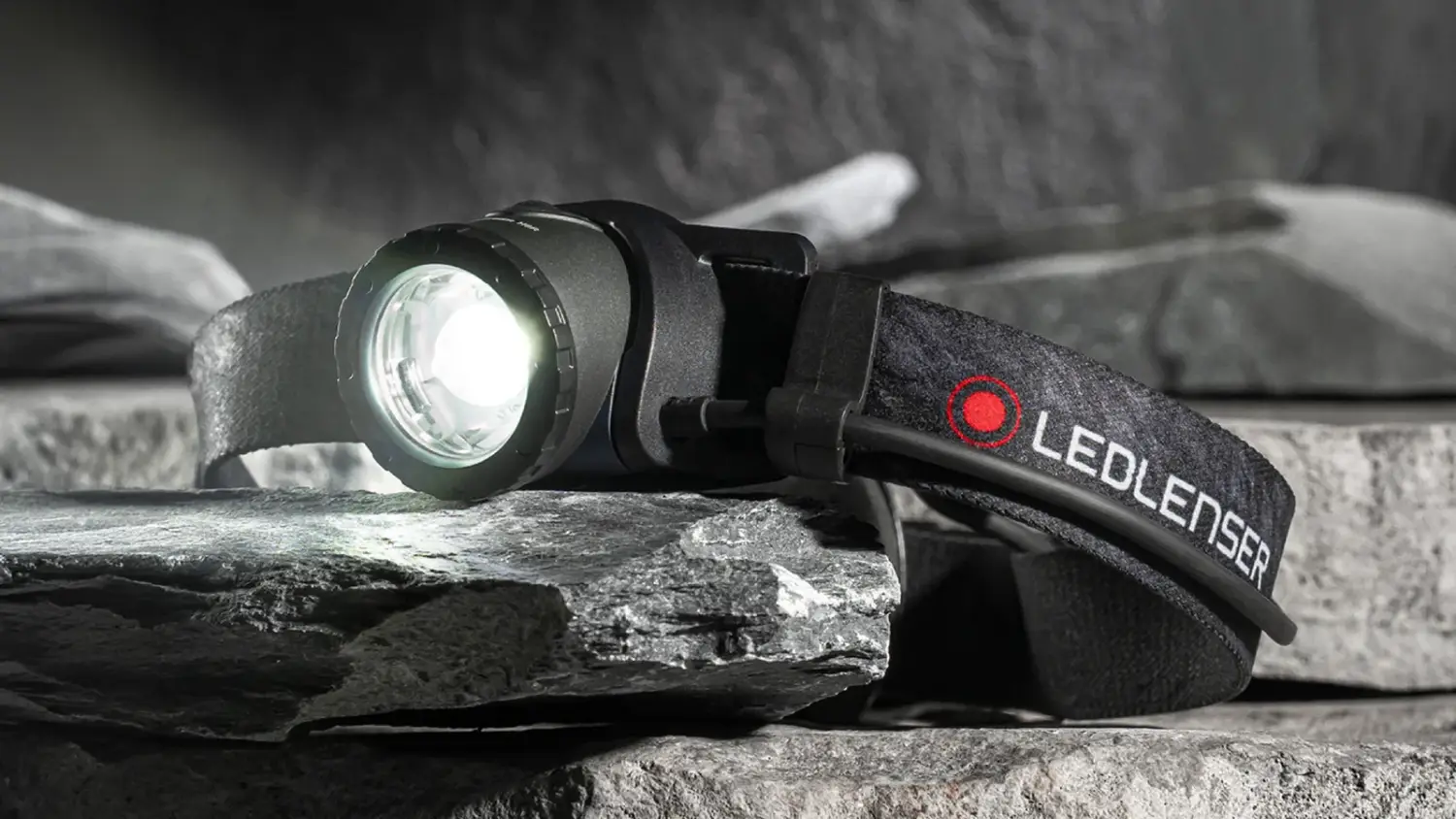 The Ledlenser H8R headlamp torch on some rocks.