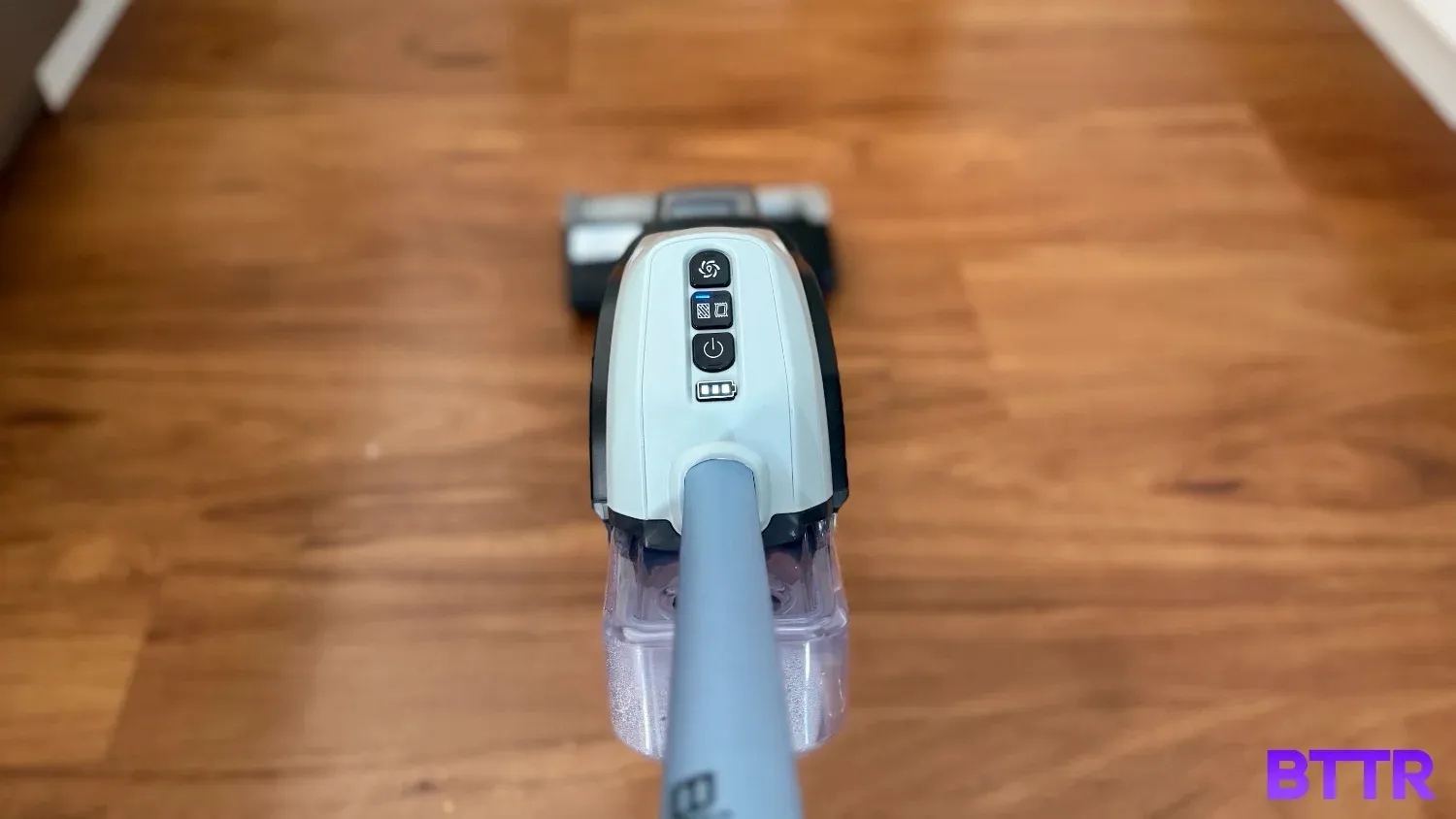 Watching the Bissell Crosswave Edge Cordless in use, with the buttons on top of the body.