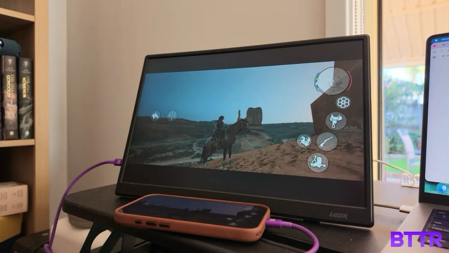 Red Dead Redemption running from an iPhone 17 Pro on the Laser 14-inch portable monitor