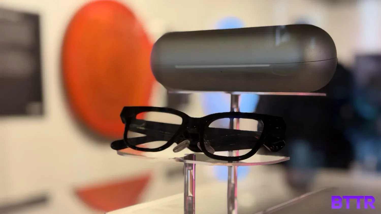 The Rokid AI smart glasses and charging case on display at the launch