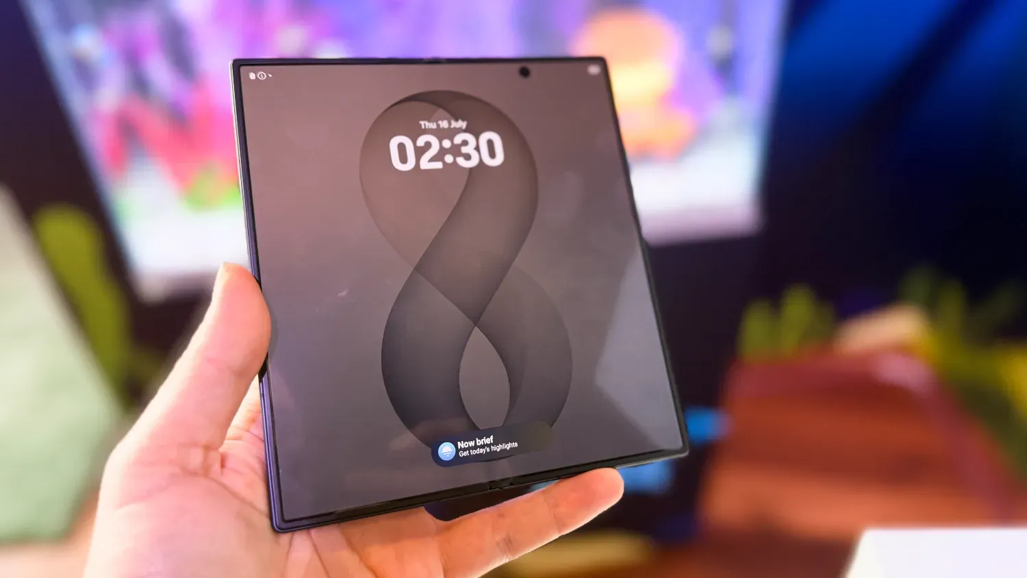A hand holding the Glaxy Z Fold8 Ultra unfolded