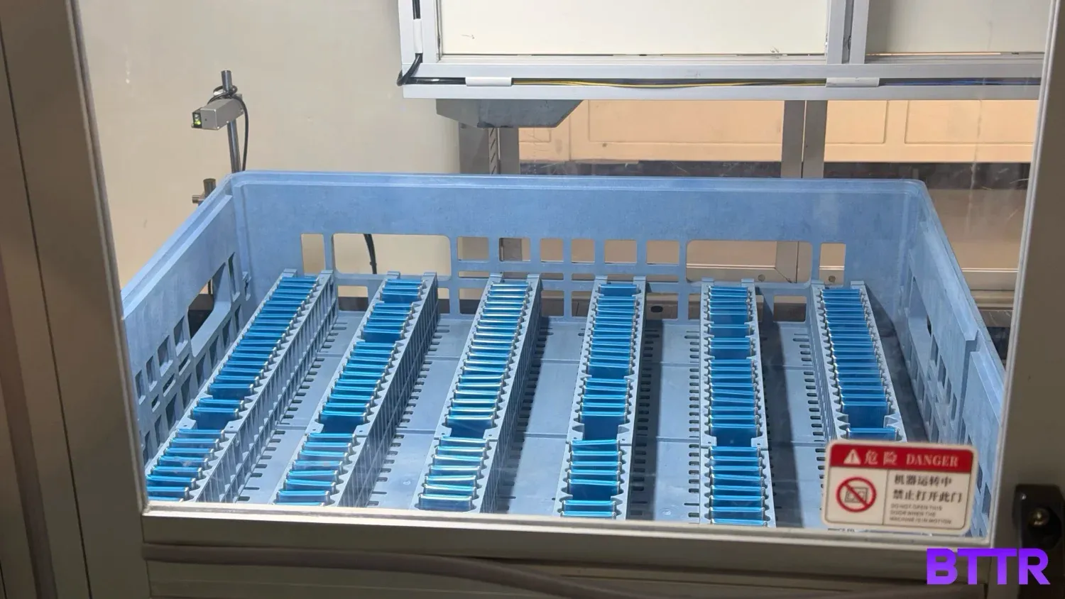 a tray of betteries being tested