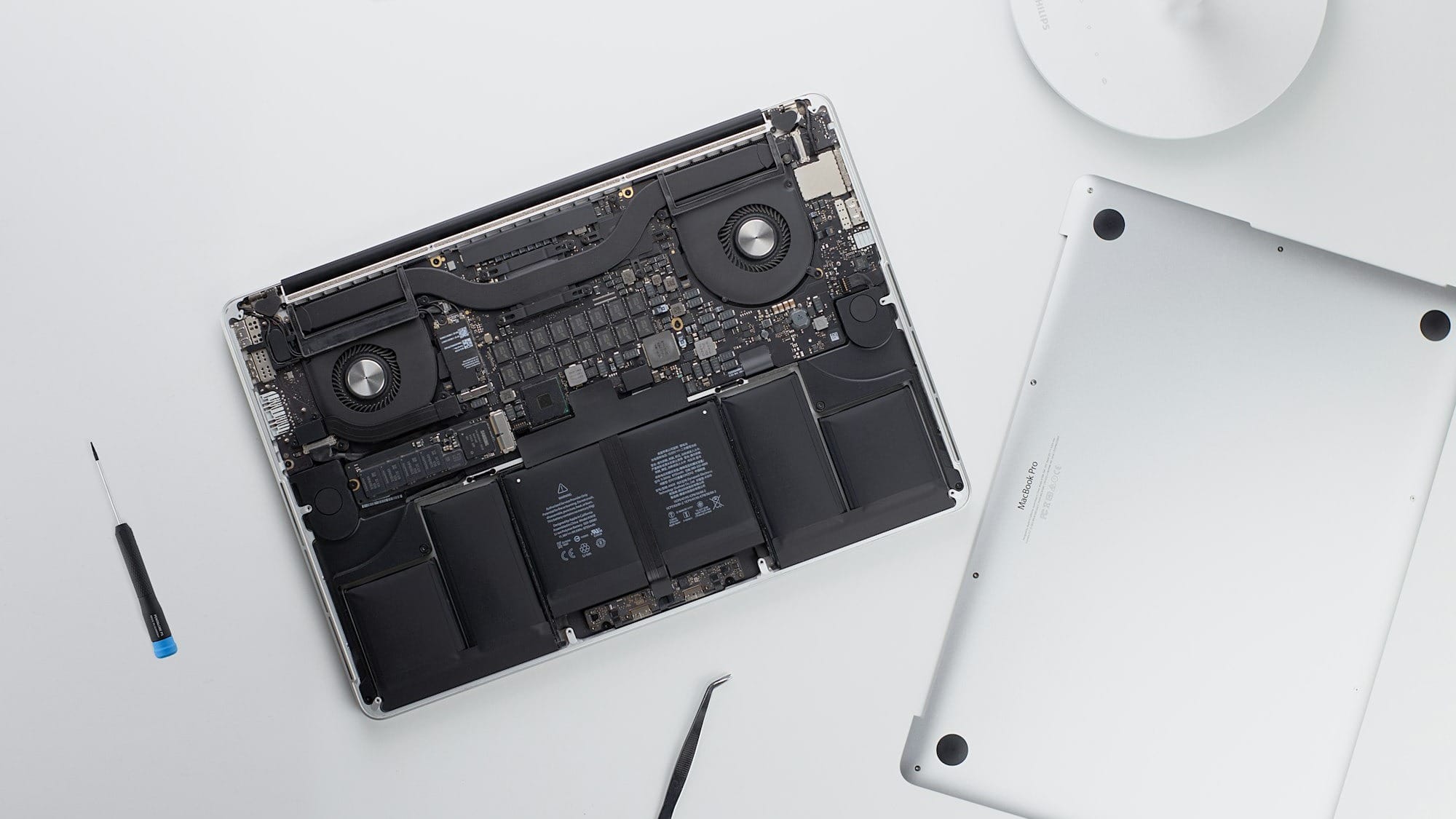 silver MacBook Pro being repaired