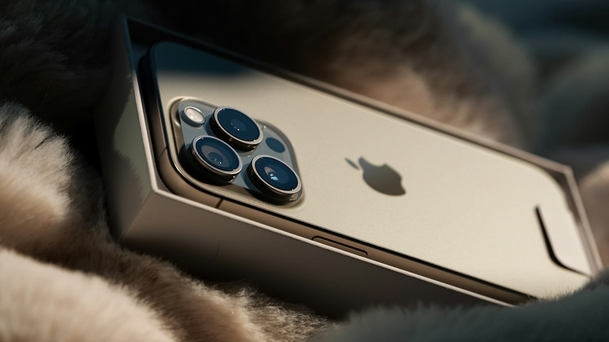 a close up of a cell phone on a blanket
