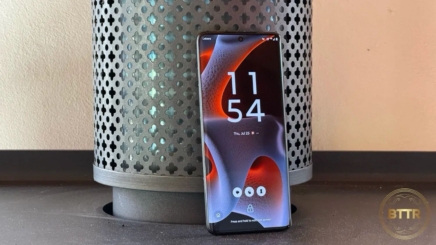 The Moto Edge 50 Pro leaning against a chimney