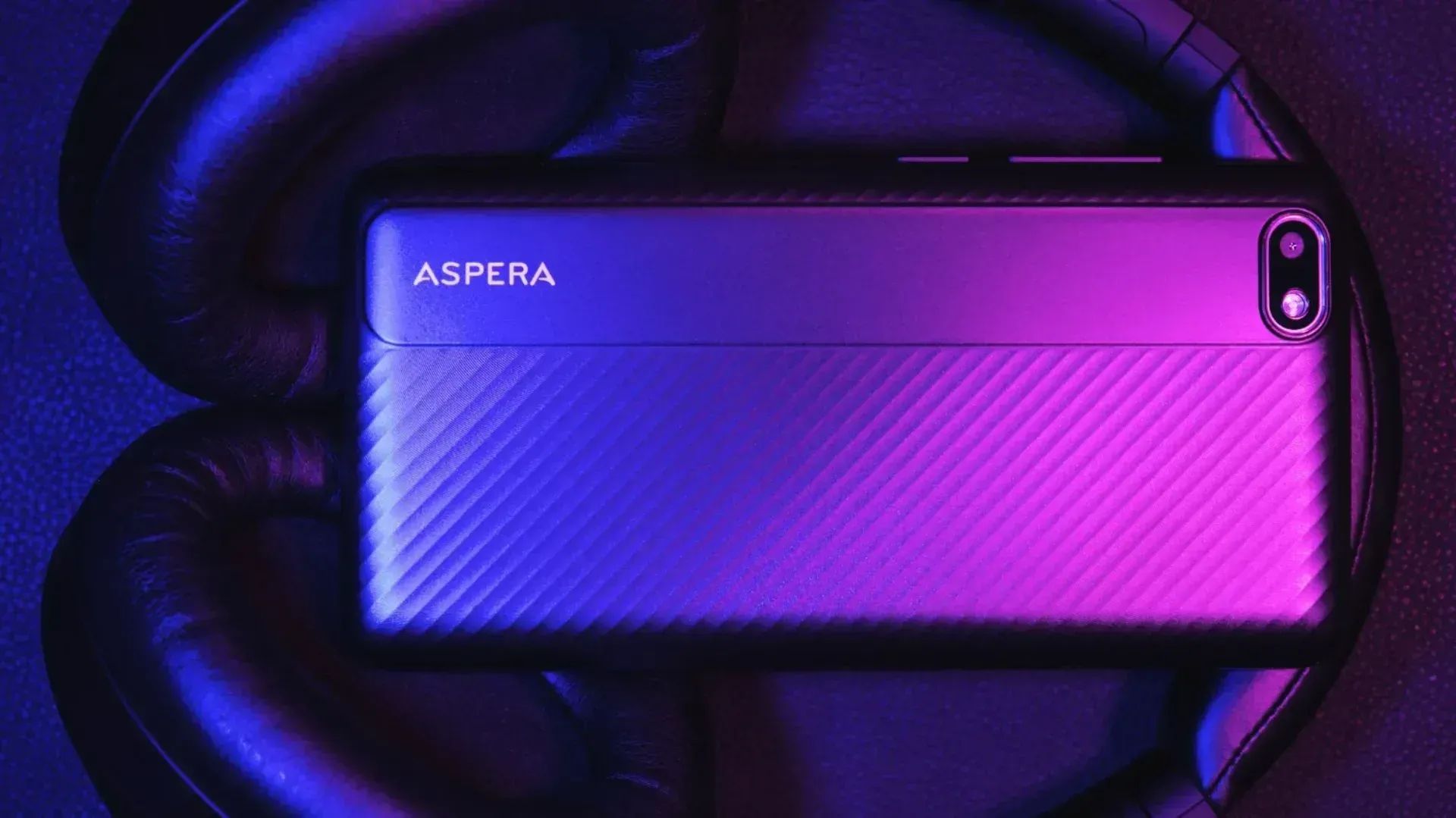 Aspera has announced the AS5 4G smartphone in Australia, pictured here in pink and purple light on a pair of headphones