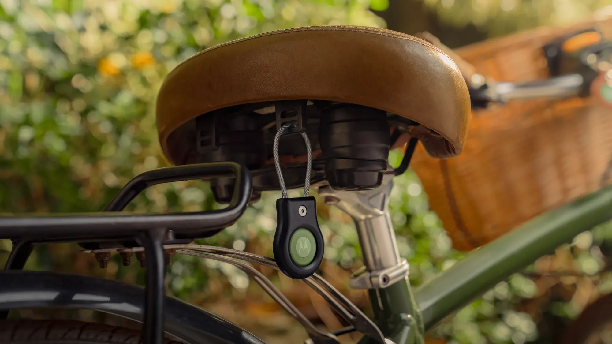 The Moto Tag attached underneath a bicycle seat.