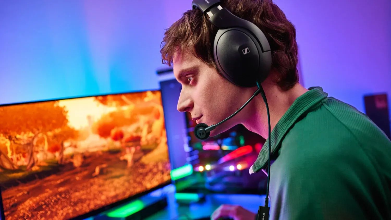 A young man playing games while wearing the Sennheiser HD 500 BAM