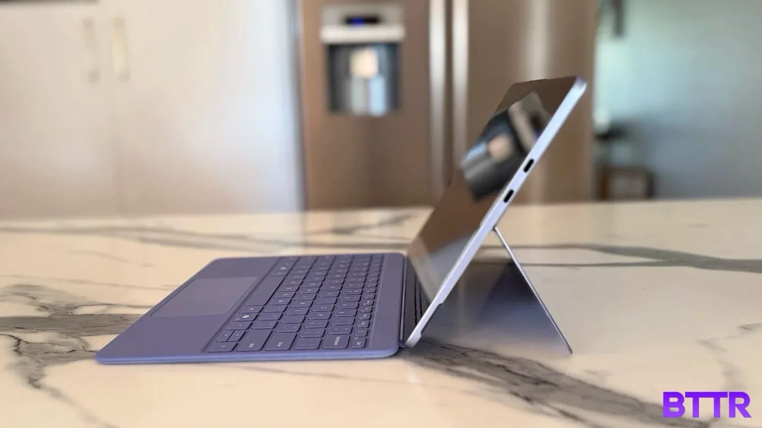 The Surface Pro 12 with the keyboard attachment, side on.