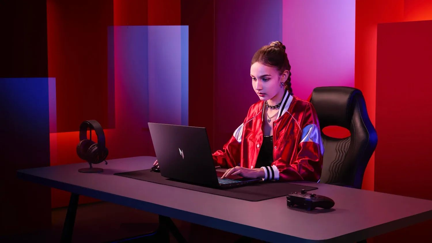 A girl using one of the new Acer Nitro laptops
