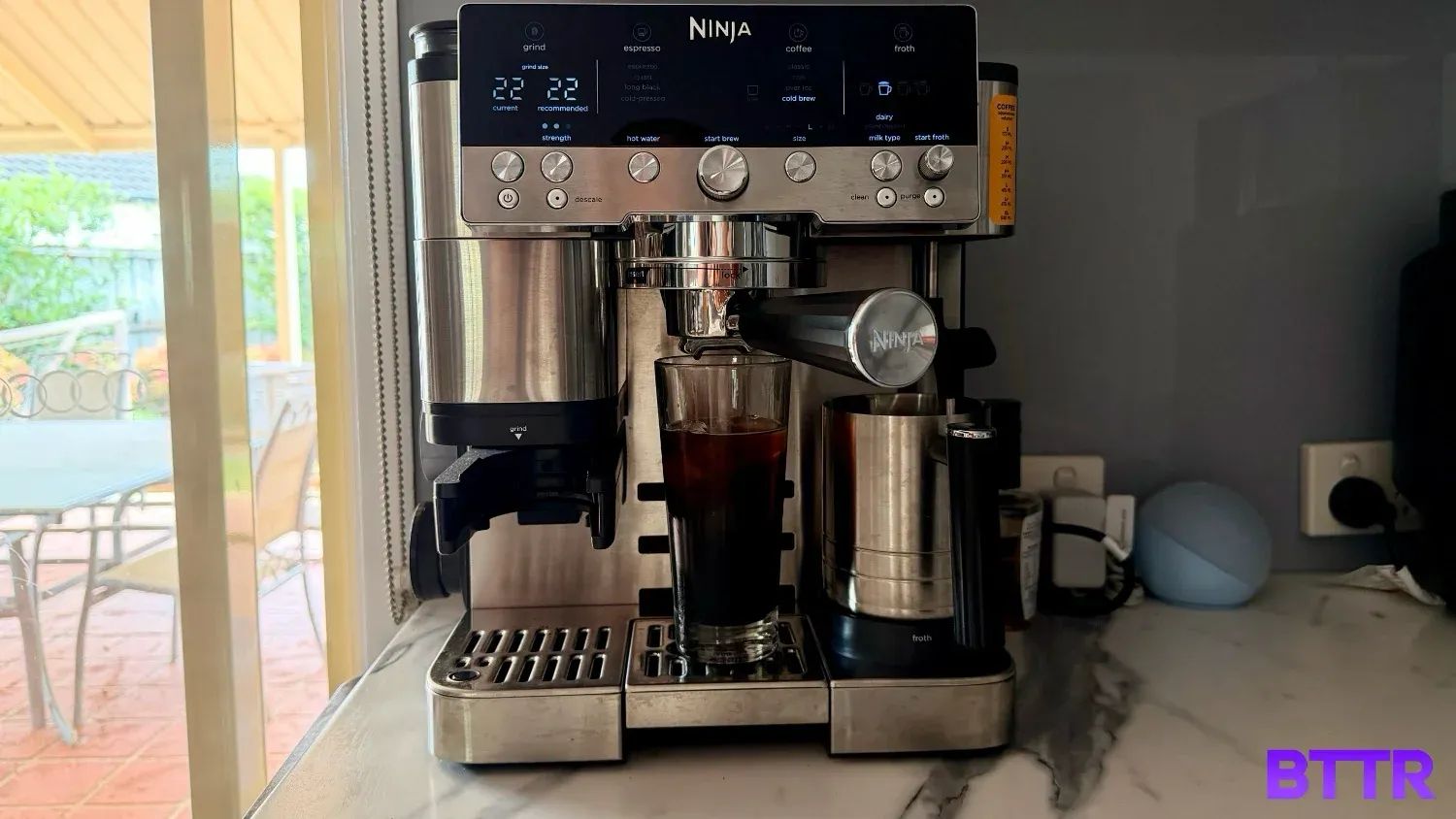 The Ninja Luxe Café Premier setup in the kitchen after brewing a cold brew in a tall glass
