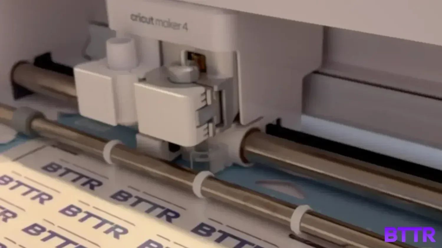 The Cricut Maker 4 cutting out BTTR stickers