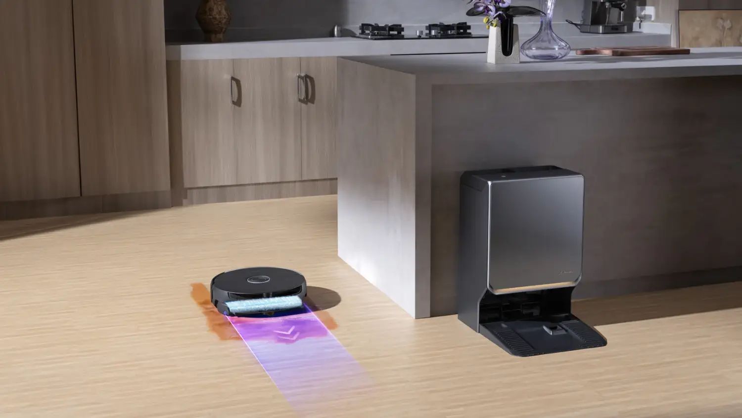 A stylised image of the Narwal Flow 2 running over a spill next to a kitchen, with the dock nearby