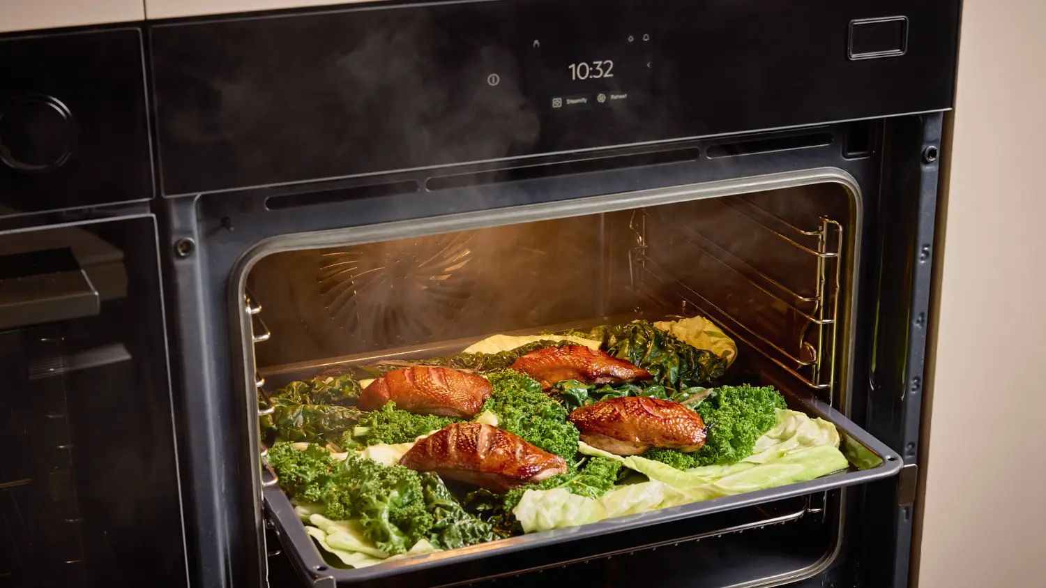 A serving of duck breast and vegetables coming out of a new Electrolux steam oven.