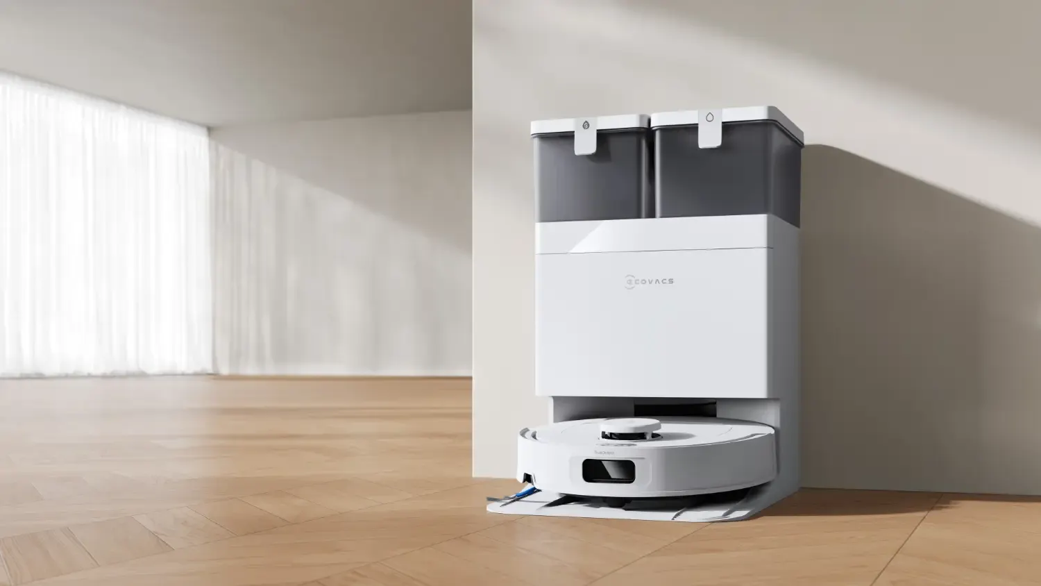 The Ecovacs Deebot T30s In an empty room with wooden floors.