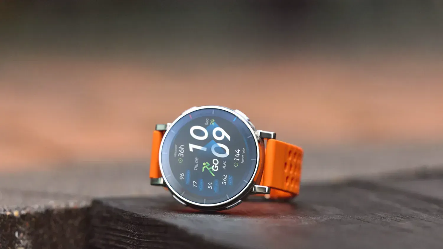 The Amazfit Active 3 Premium with an orange band 