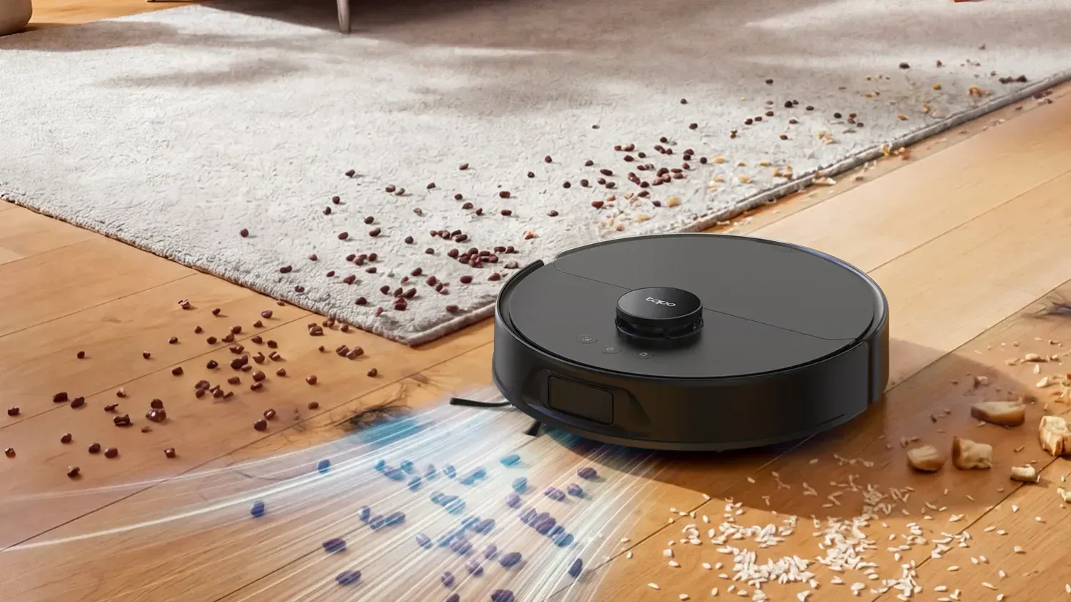 A stylised image of the Tapo RV50 robot vacuum claning up a lot of mess.