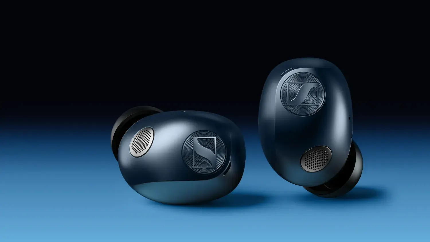 The denim sennheiser momentum true wireless 5 earbuds on a blue and black background