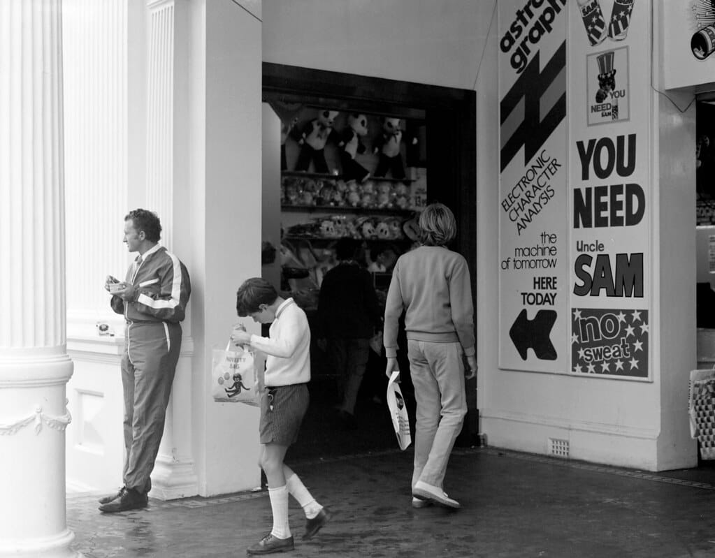 A young boy walks past an 