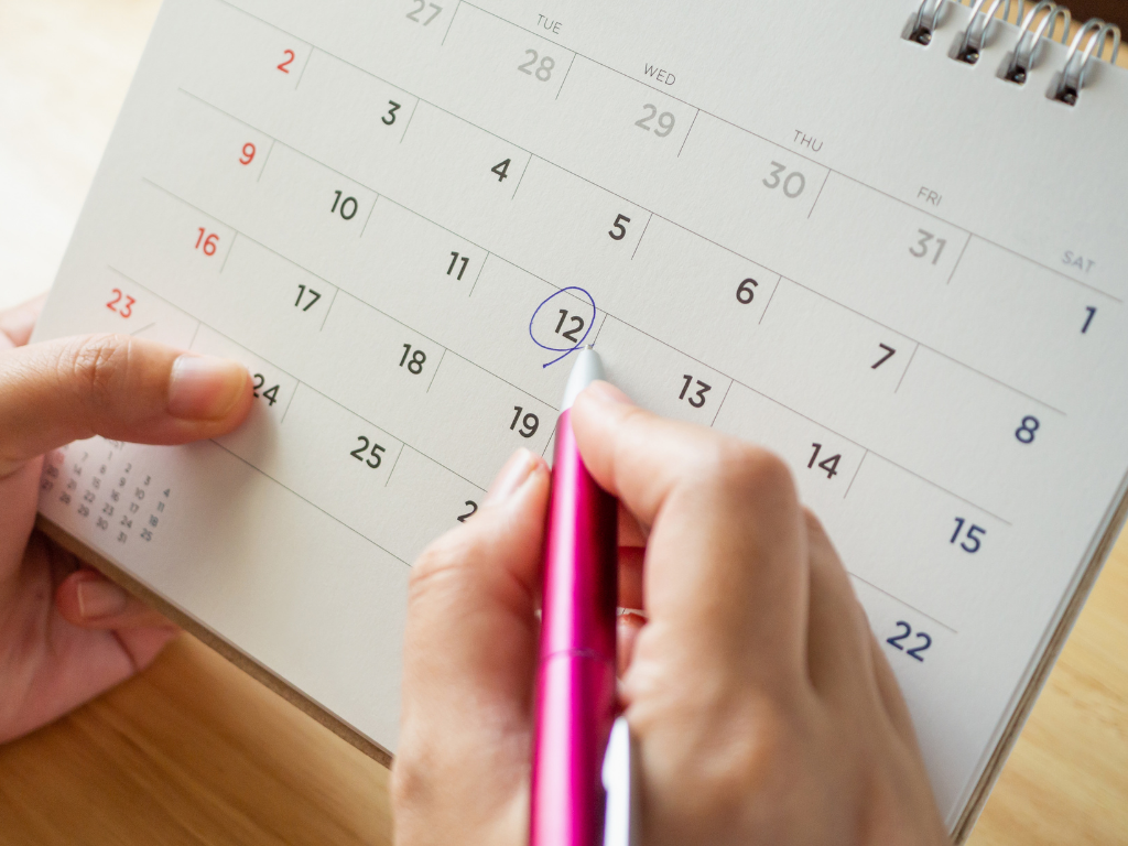 Pen circling a date on a calendar; MCAT registration date