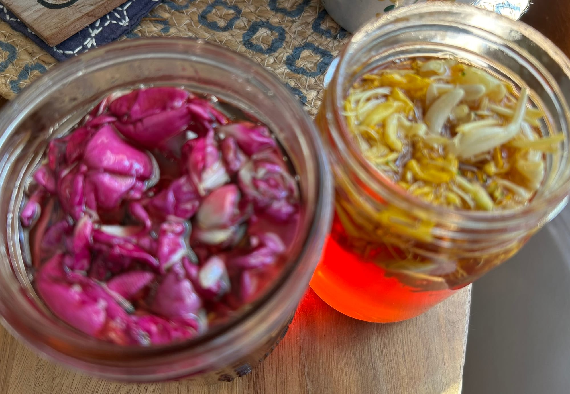 Photo of rose petals and honeysuckle flowers infused in honey