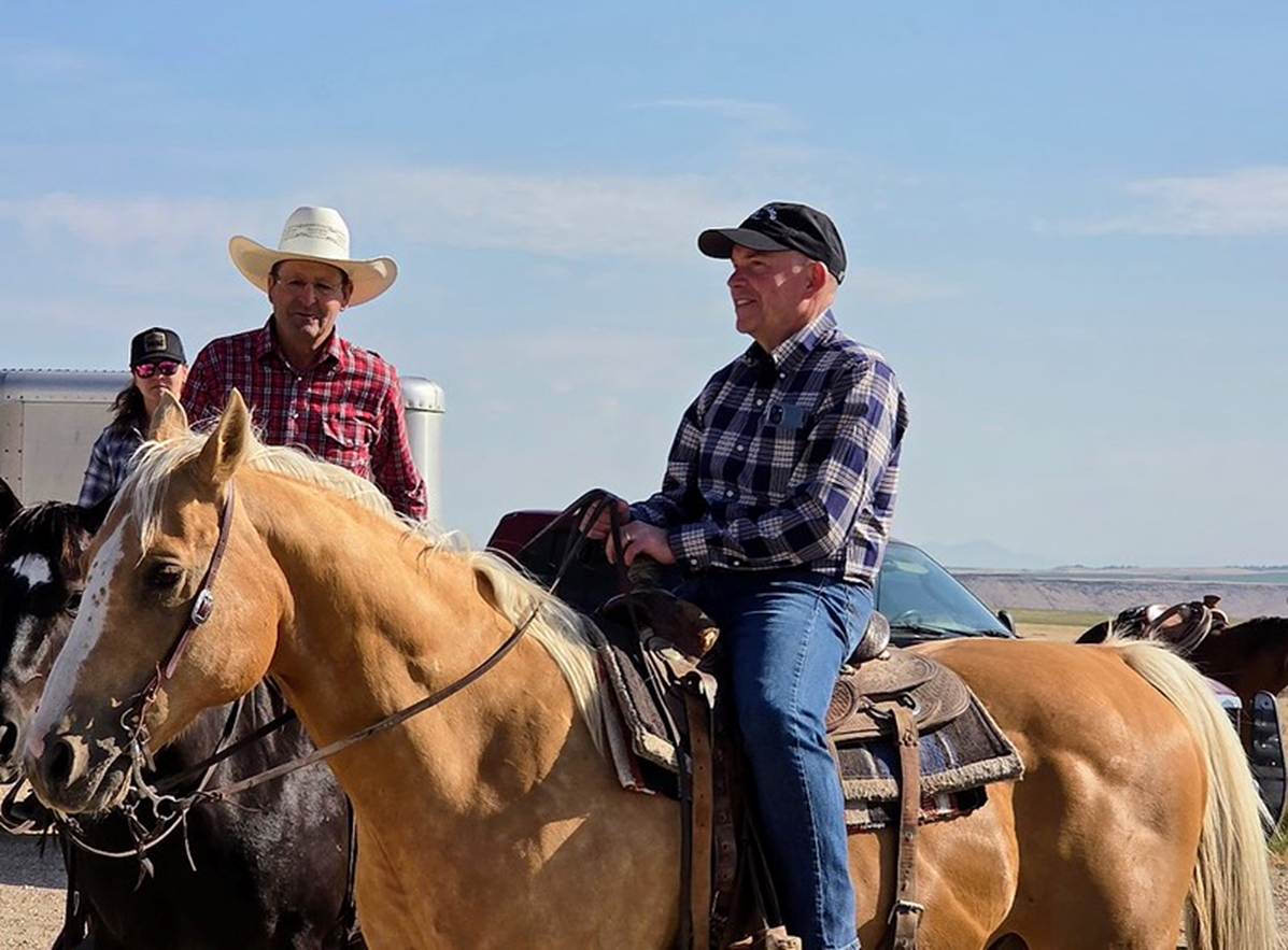 A group of men riding horses

AI-generated content may be incorrect.