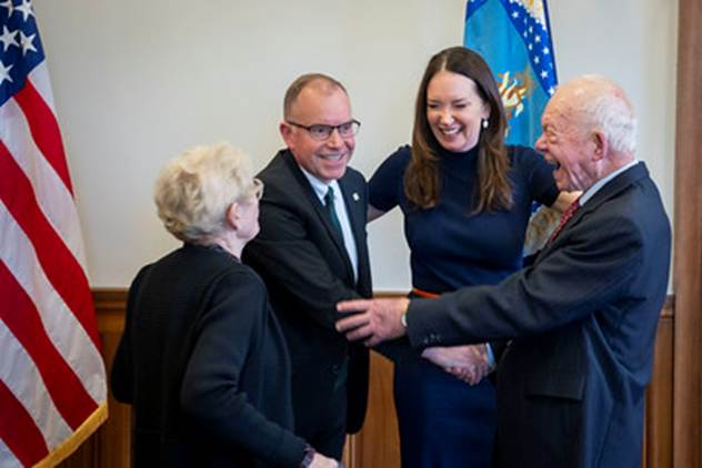 A group of people shaking hands

AI-generated content may be incorrect.