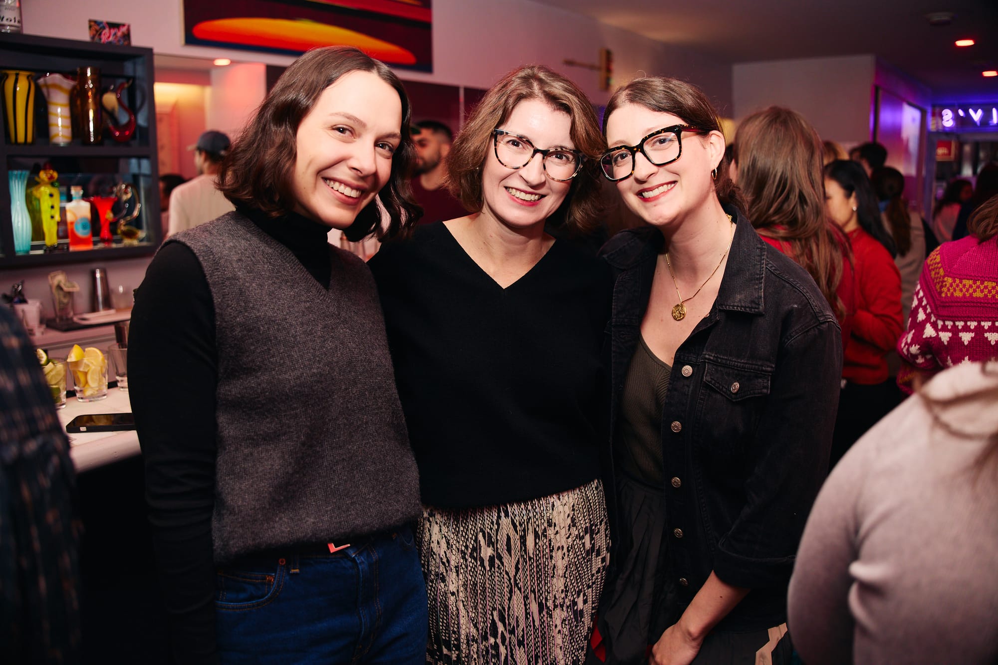Three women smiling