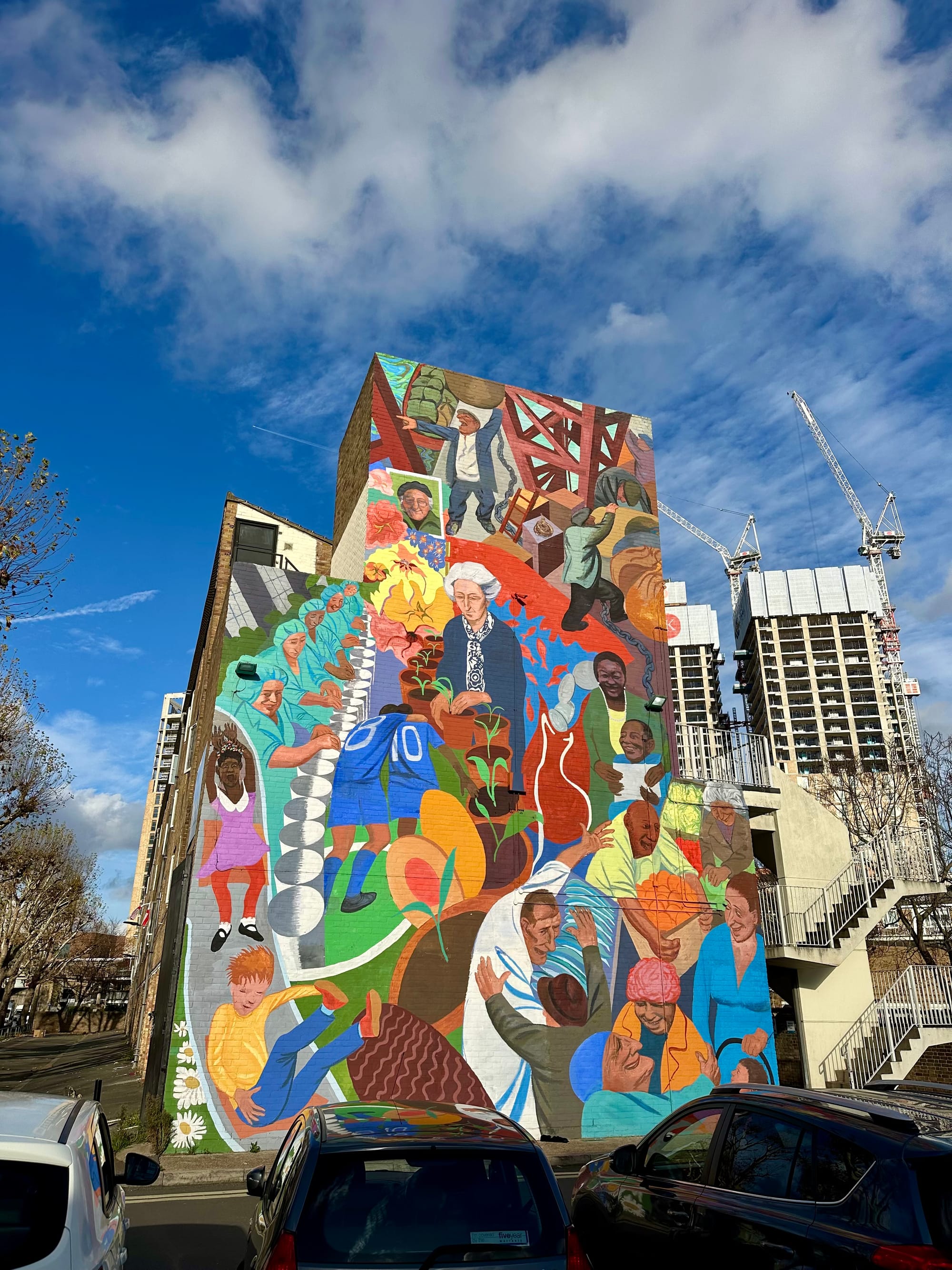 Colourful mural showing local figures who live on and around the Bermondsey Blue Market.