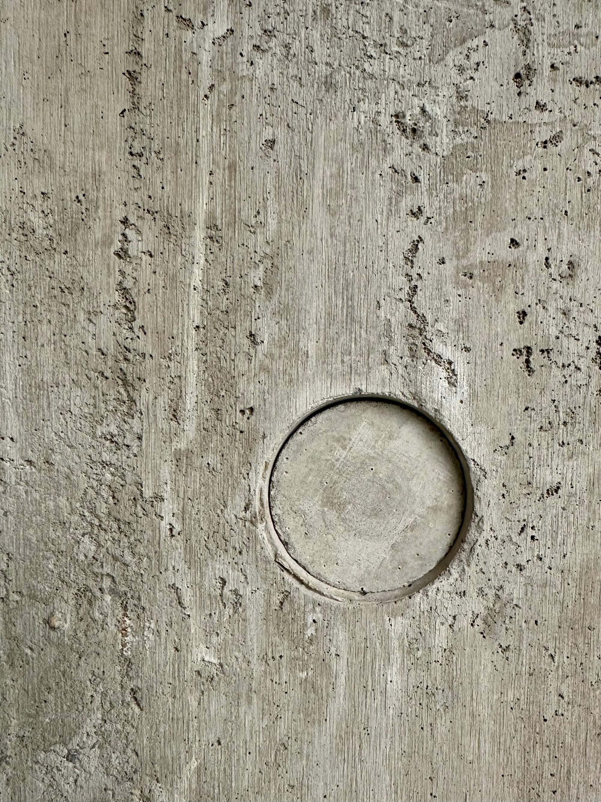 Circular indentation in a poured concrete wall, RCA Dyson Building.