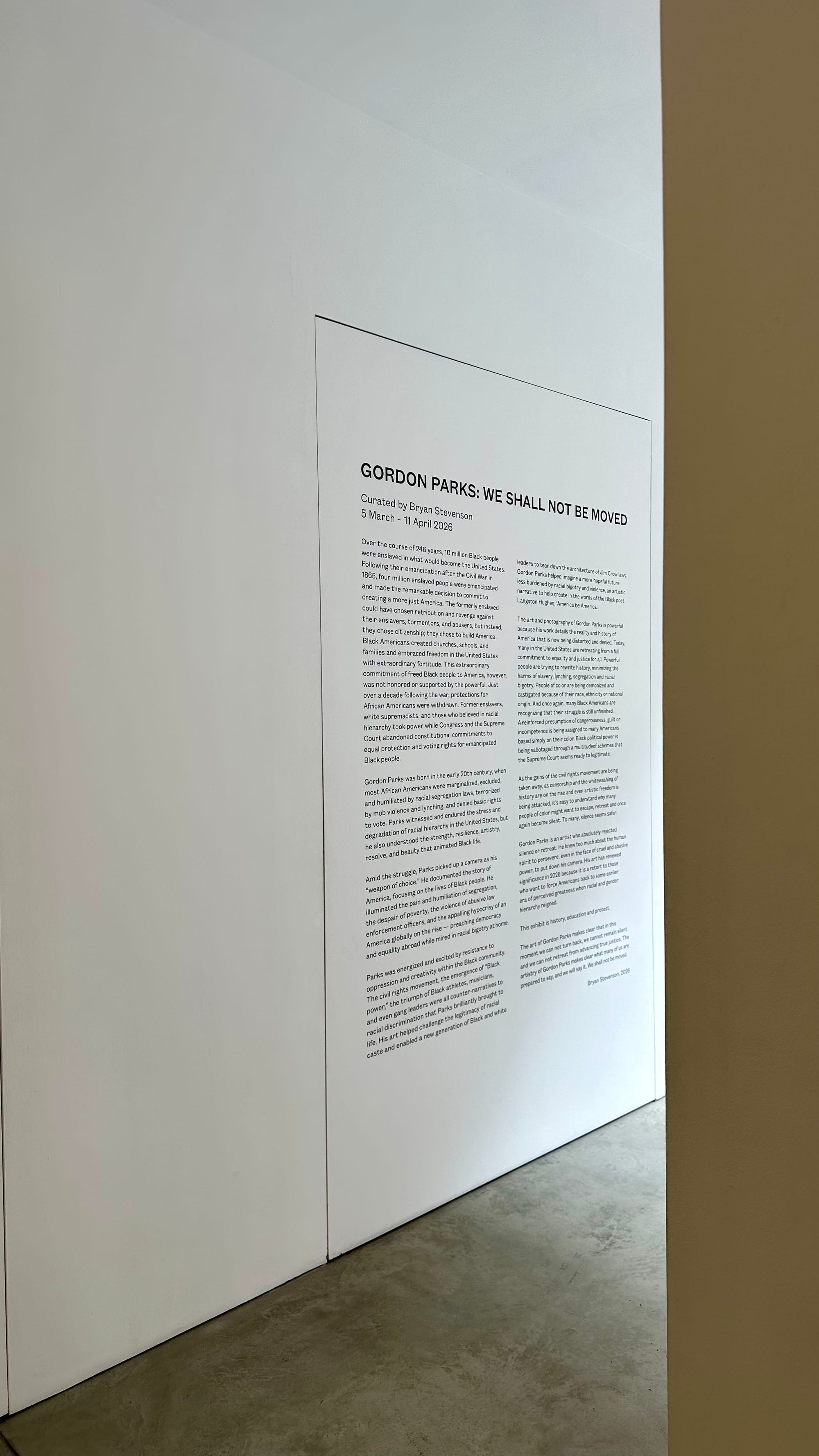 Curator's text on the wall in a gallery of Gordon Parks' We Shall Not Be Moved exhibition.
