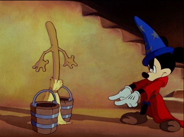Still from Disney' Fantastia showing Mickey Mouse as The Sorcerer's Apprentice commanding a broom.