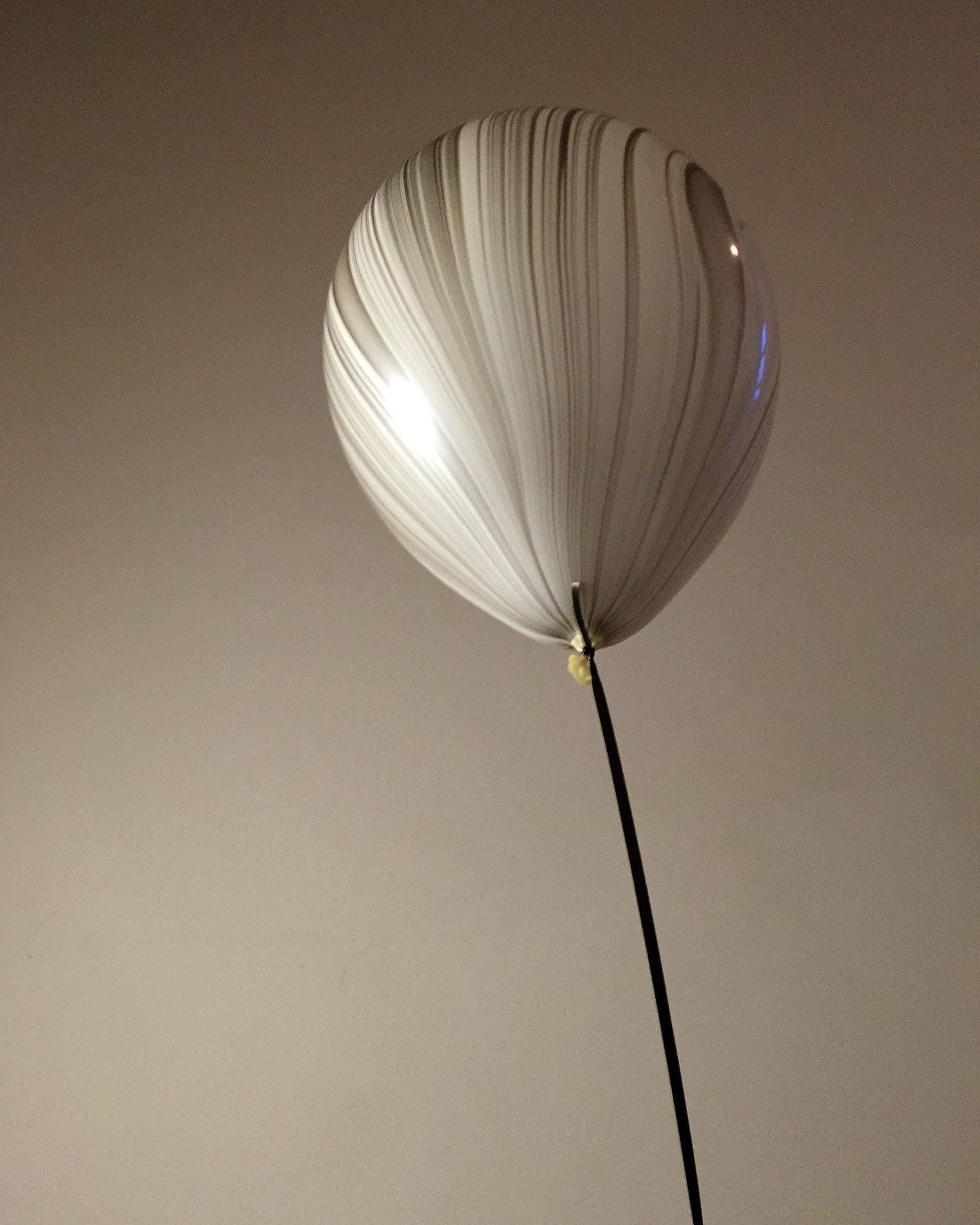 White and grey striped balloon from a show by Patternity, December 2015
