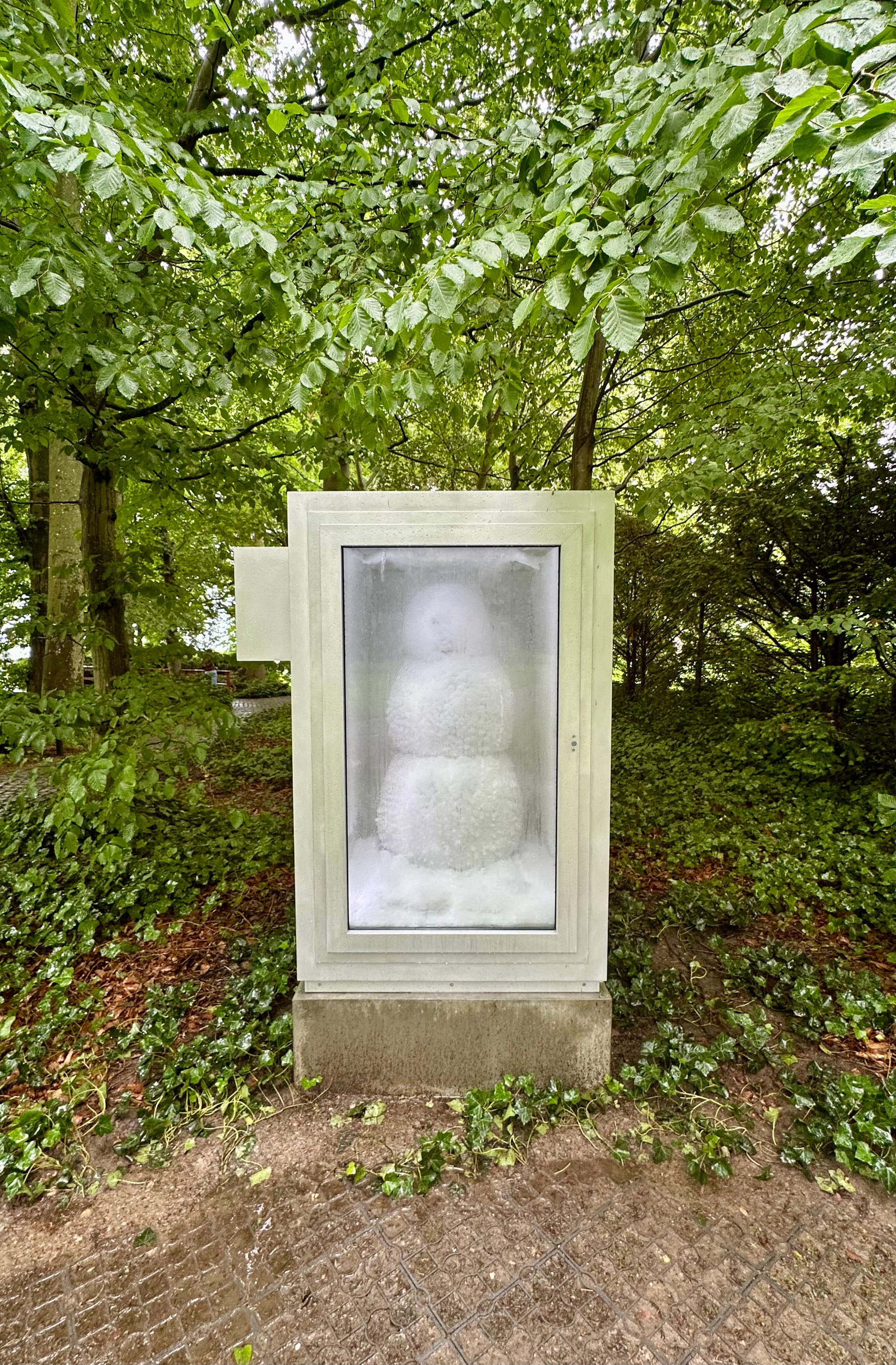 Snowman by David Weiss and Peter Fischli, installed in the garden of Louisiana Museum in Denmark.